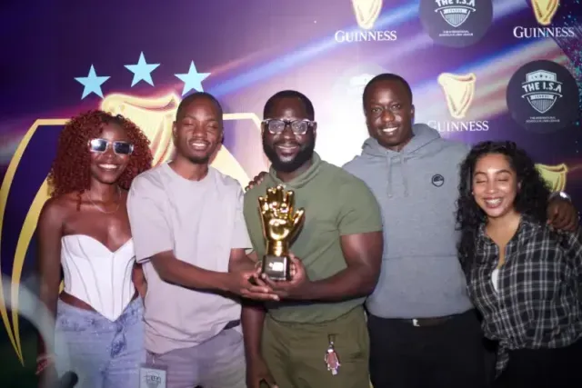 Ronnie Kasujja being awarded the golden glove