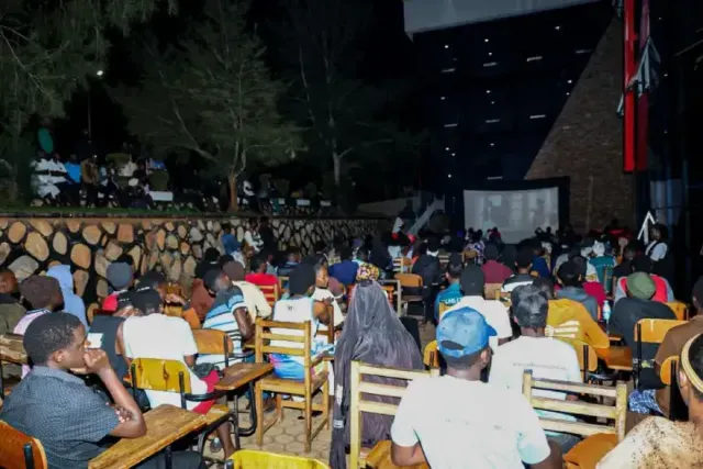 Youths watching film at a cinema in Uganda