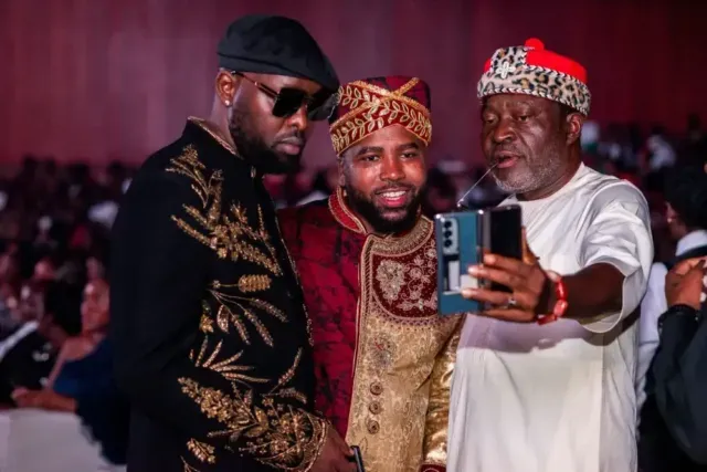 Left to Right: Musician, Eddy Kenzo, iKON Founder and CEO, Humphrey Nabimanya, and legendary Nigerian actor, Kanayo O. Kanayo, take a selfie during the 3th Annual iKON Awards 2026 at the Kampala Serena hotel.