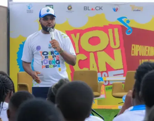 Humphrey Nabimanya the CEO Reach a Hand Uganda speaks to the the audience