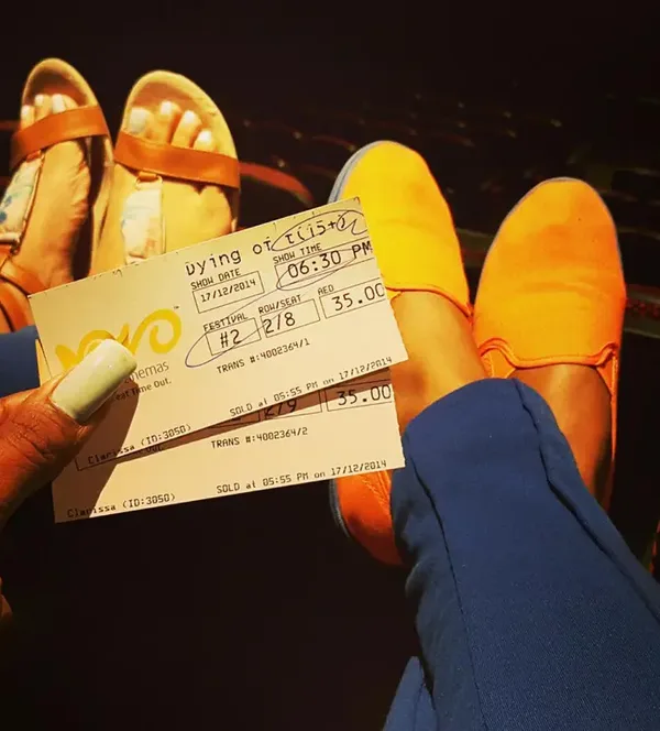 two-ladies-holding-tickets-shoes